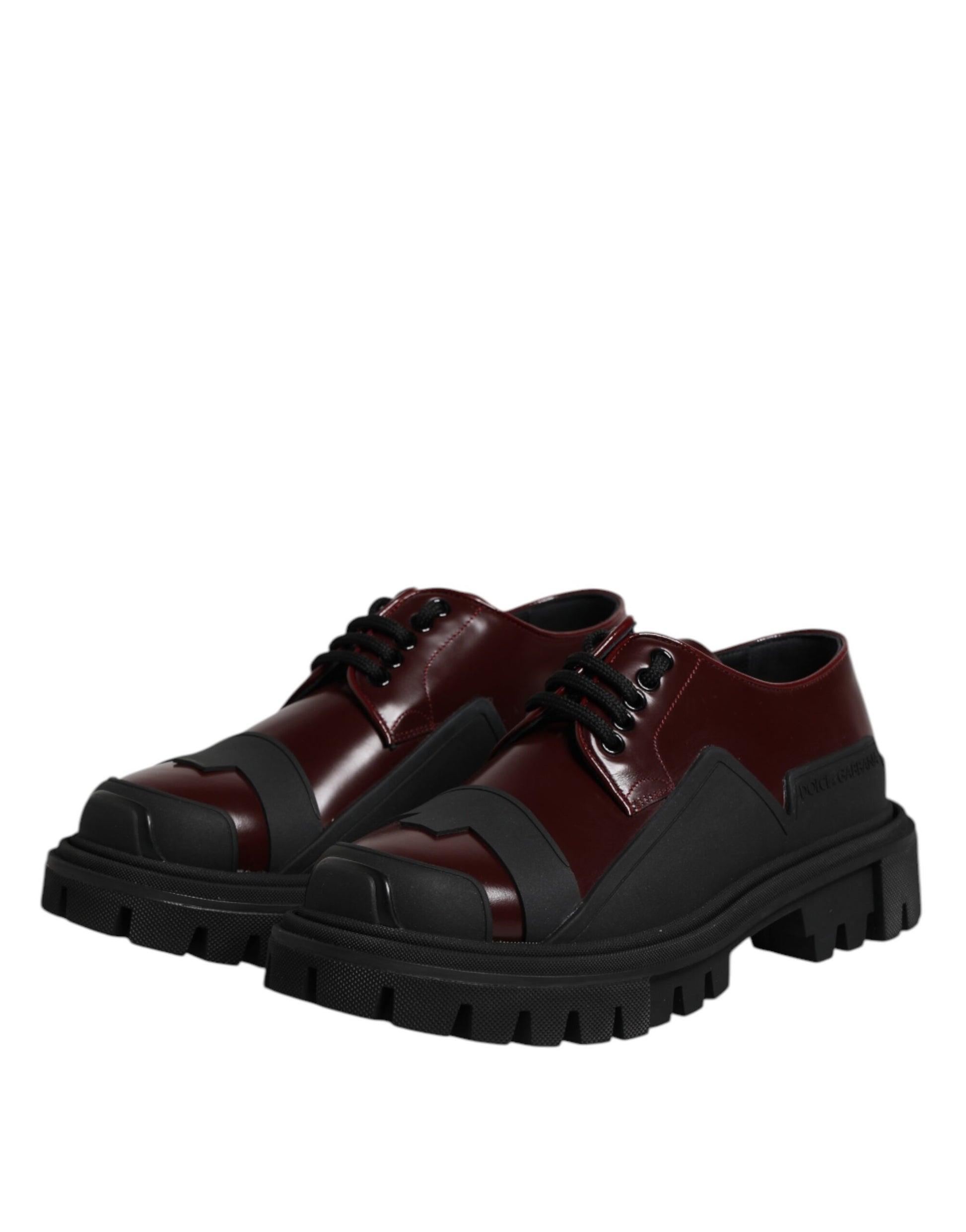 A pair of red lace-up shoes with black soles, featuring a trekking design