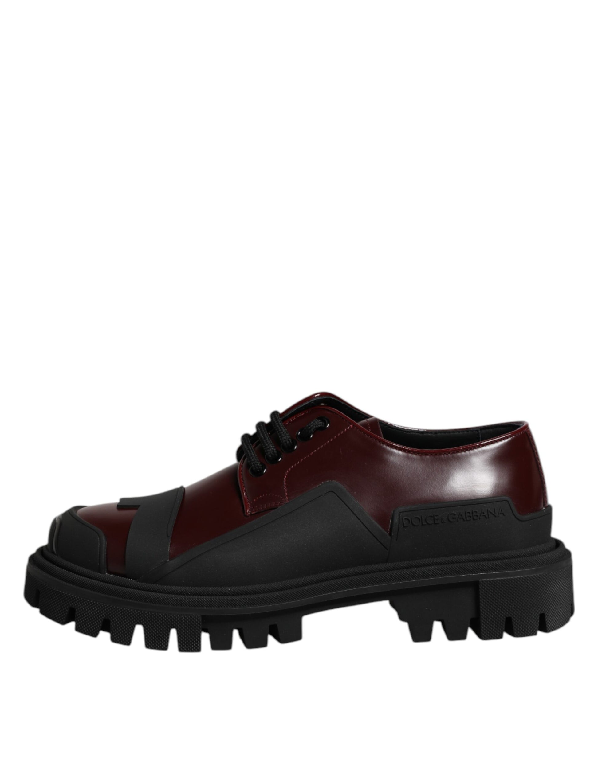 A pair of red lace-up shoes with black accents and a chunky sole