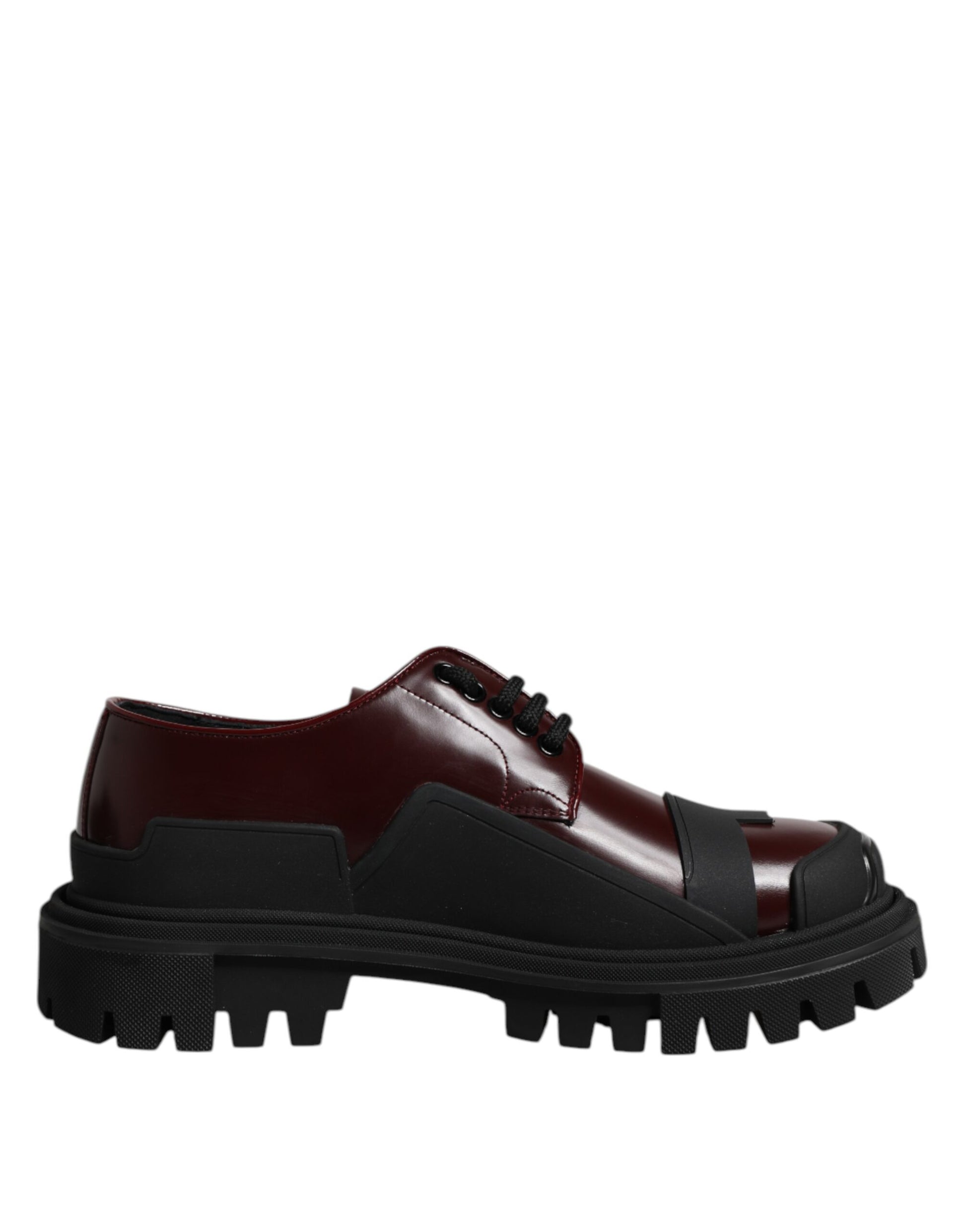 A pair of red leather lace-up shoes with black soles and silver buckles