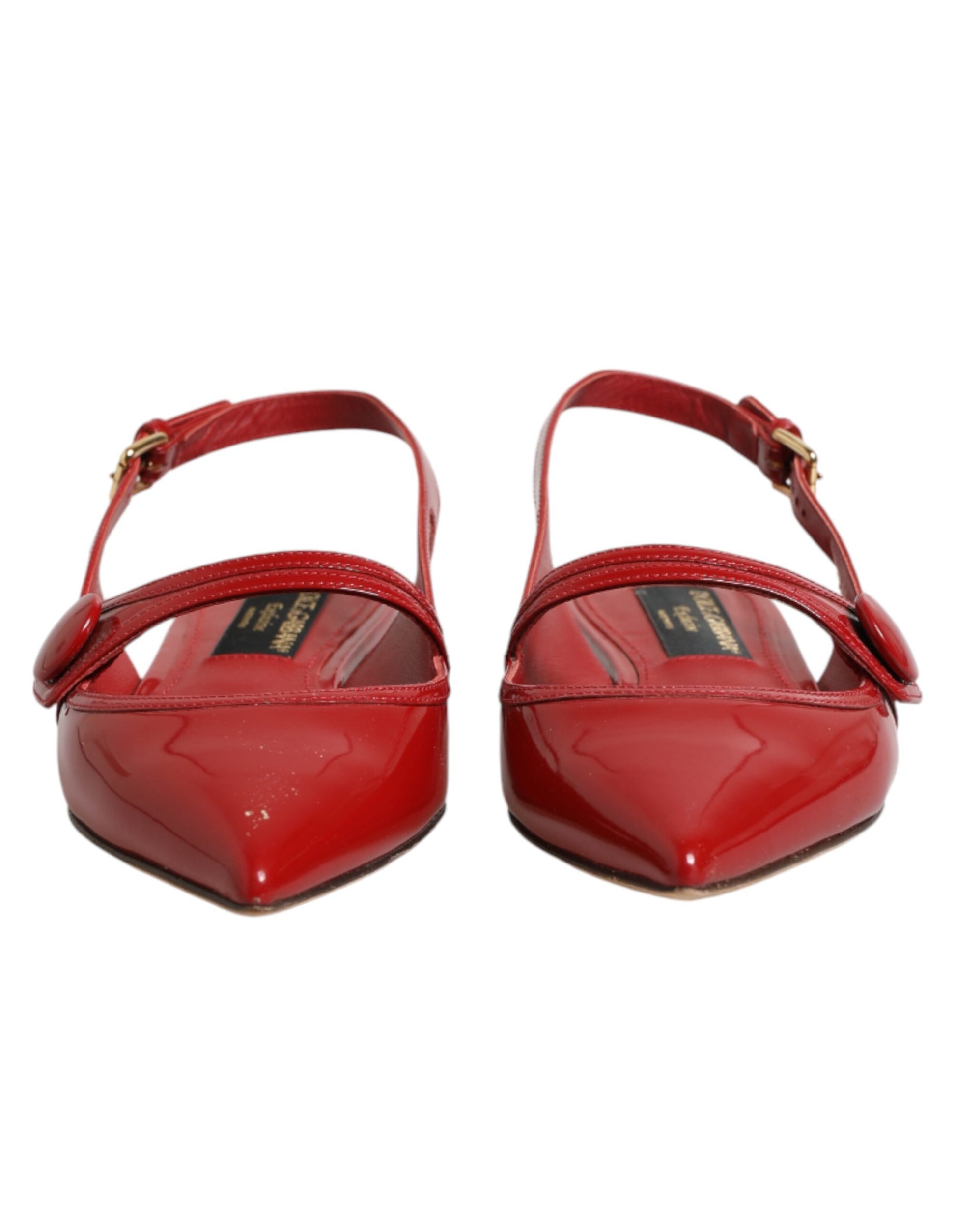 Red high heel shoes with gold accents