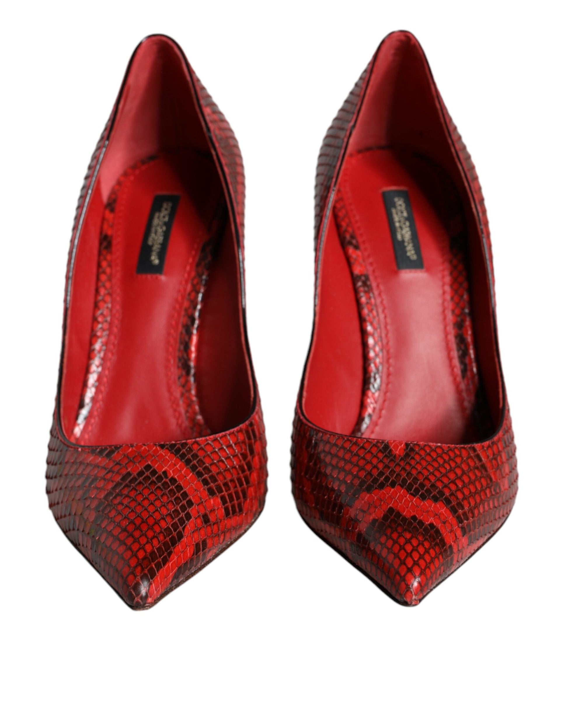 Red high heel shoes with embossed design on toe