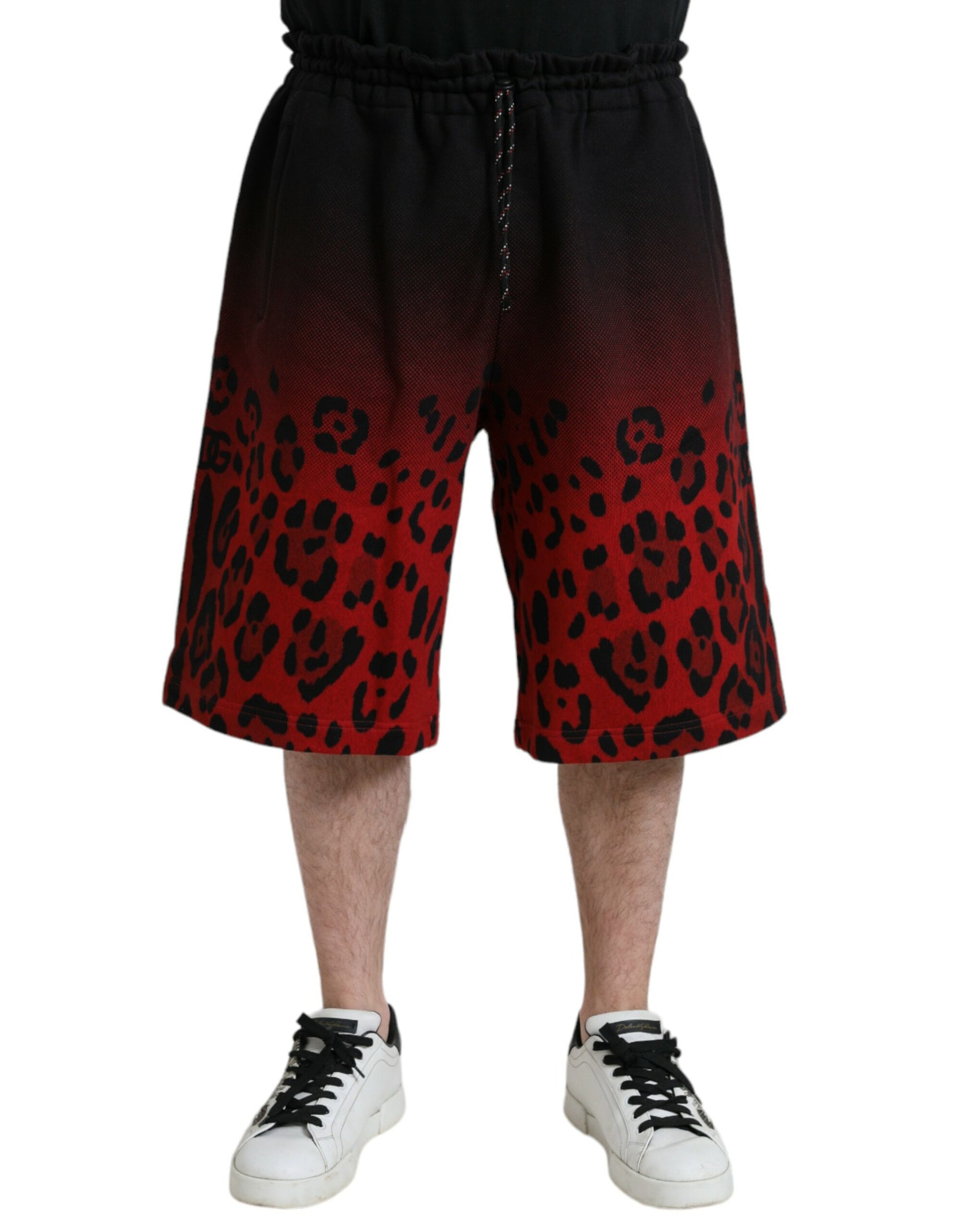 Man wearing shorts with red and black pattern