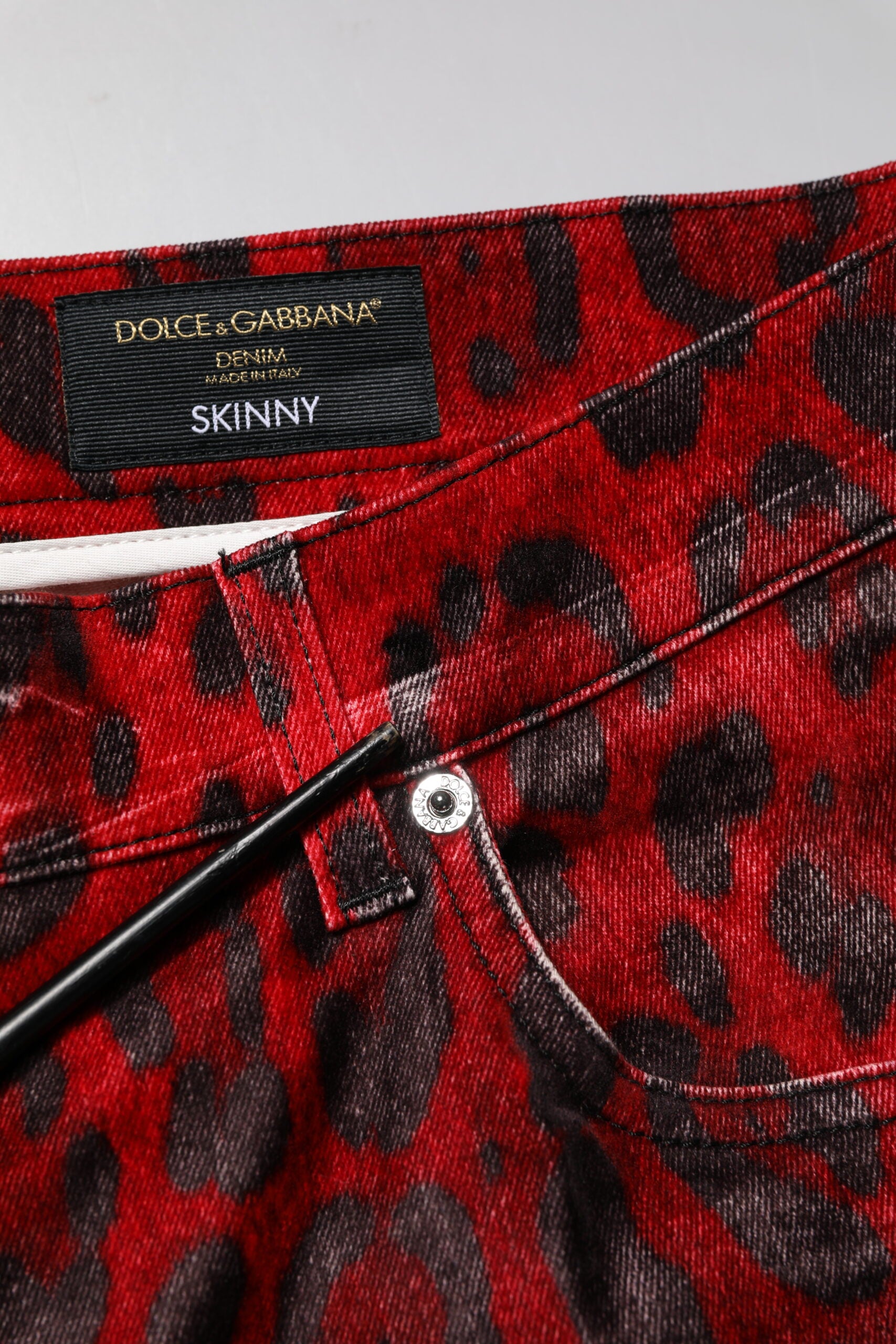 Leopard print skinny jeans with a brand label on waistband