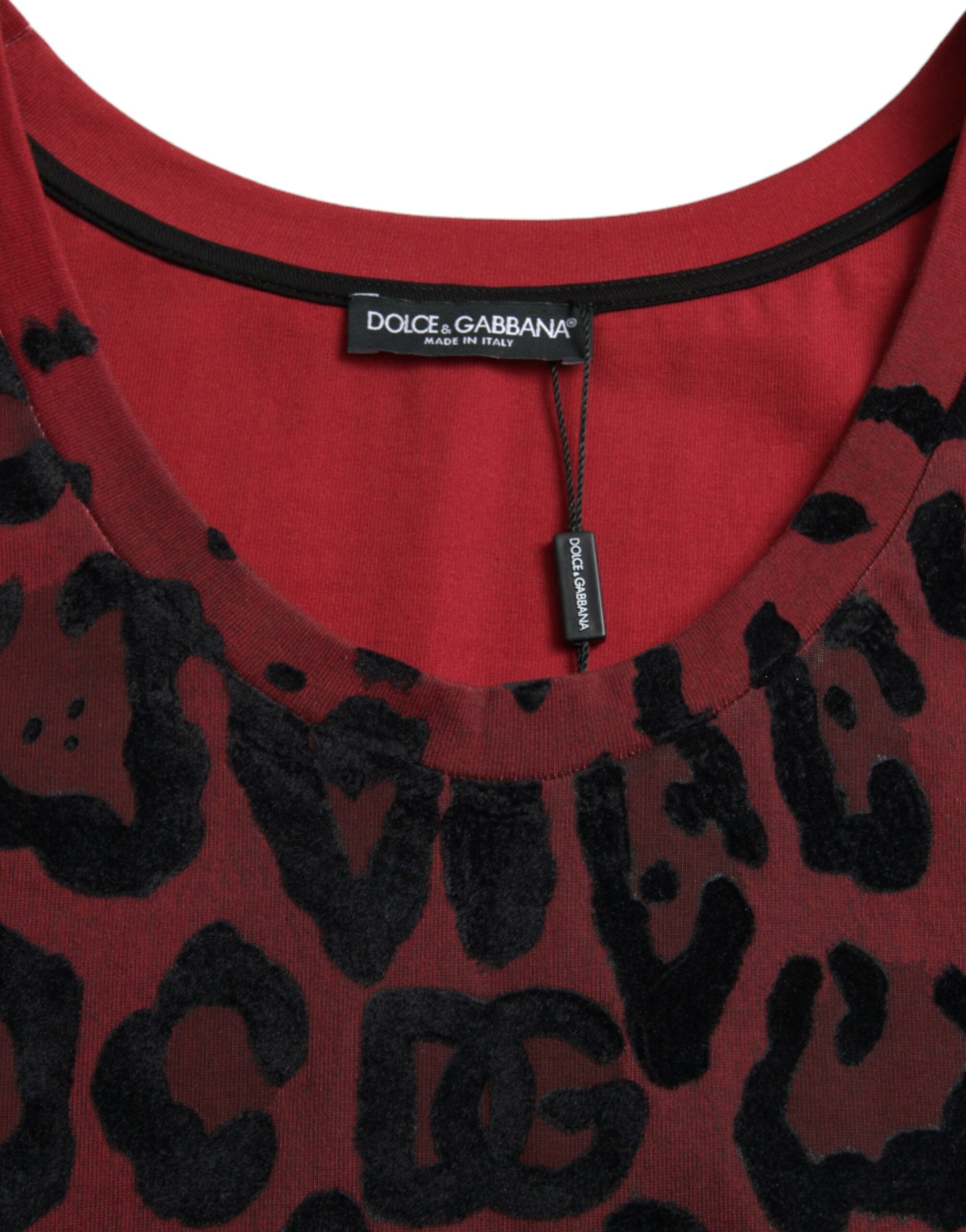 Red and black patterned shirt with a zipper tag on the neckline