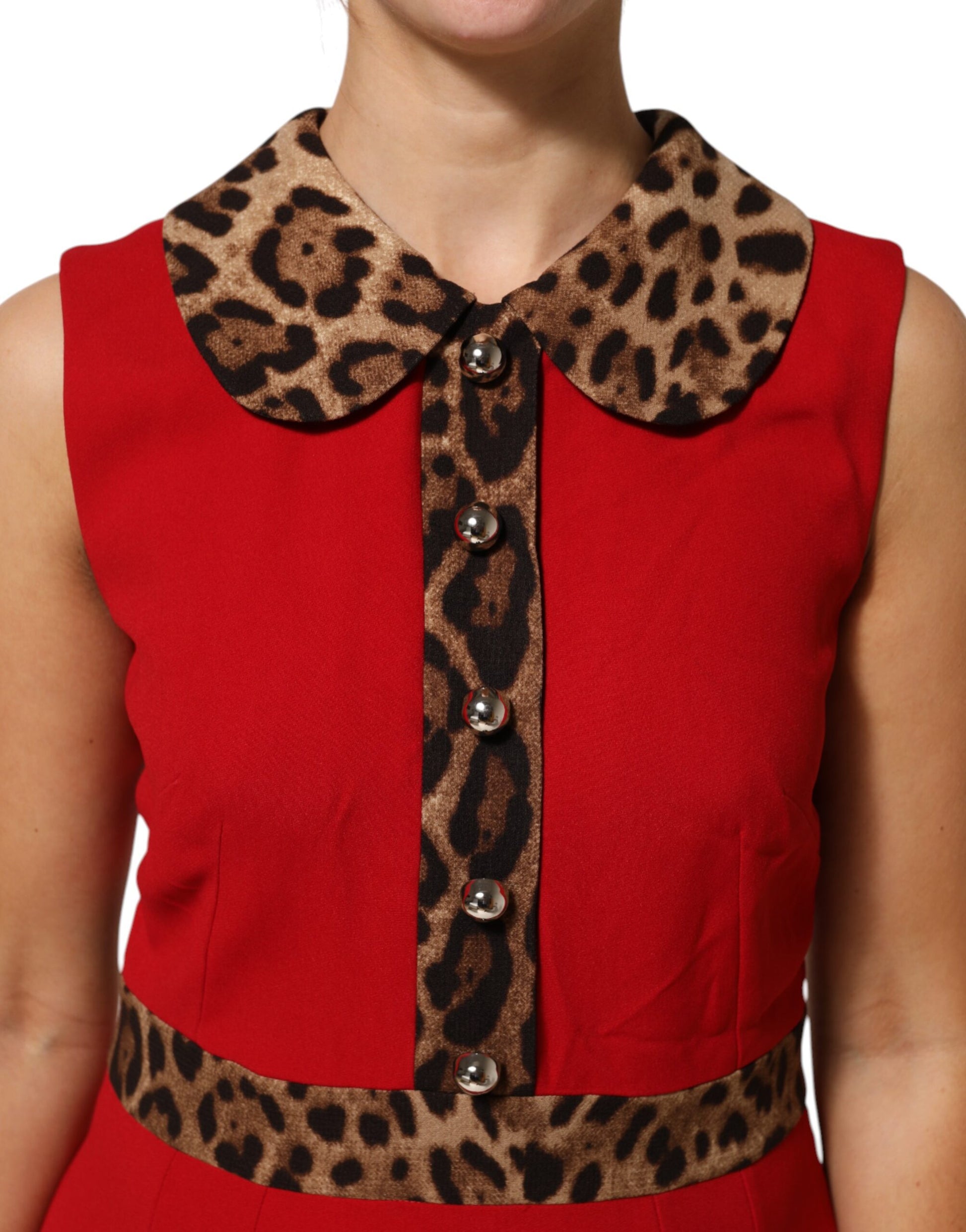 A red dress with leopard print collar and buttons, made of viscose fabric. It is an A-line style dress from t