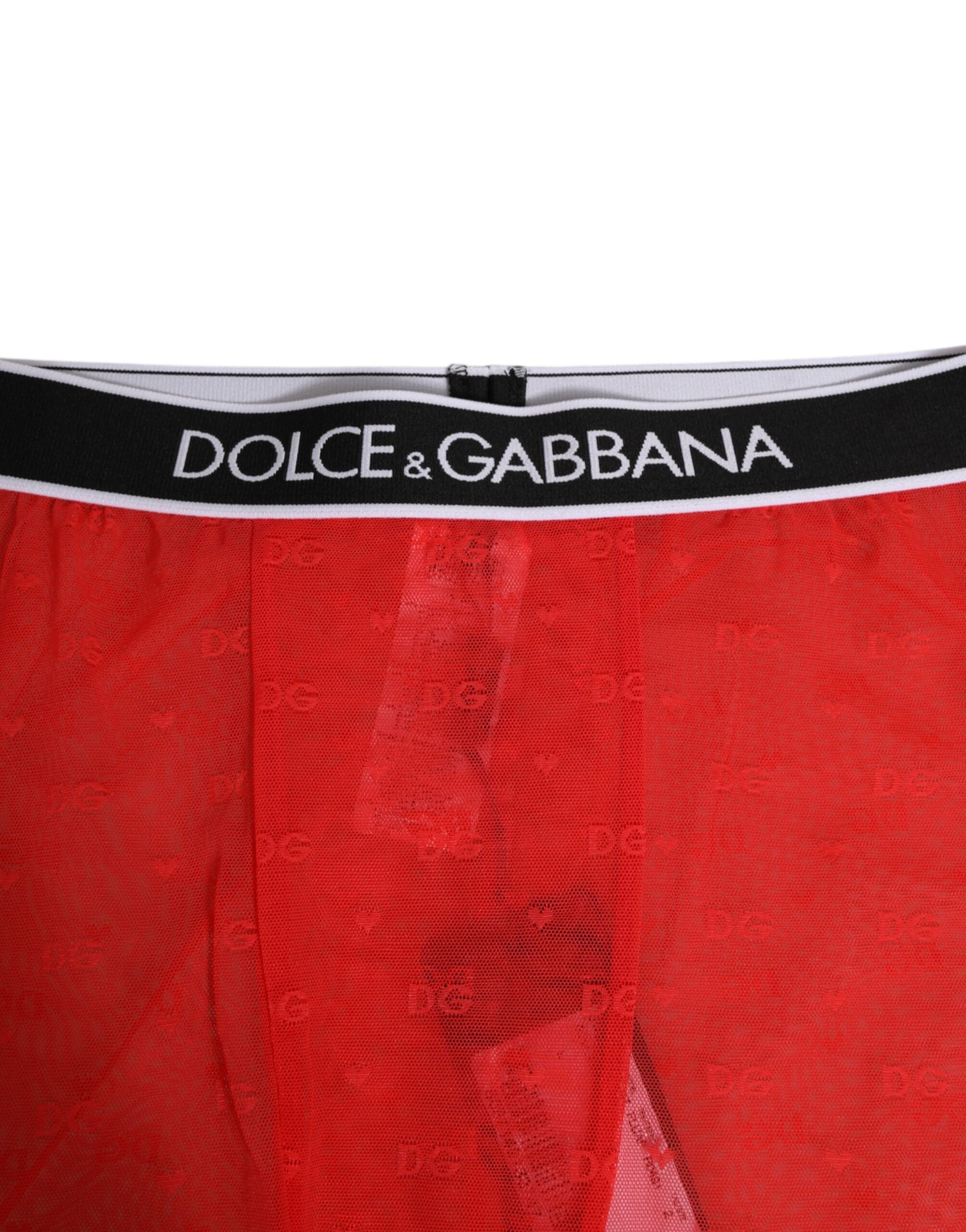 Red boxer shorts with brand name on waistband