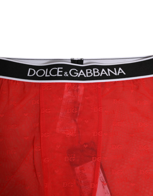 Red boxer shorts with brand name on waistband