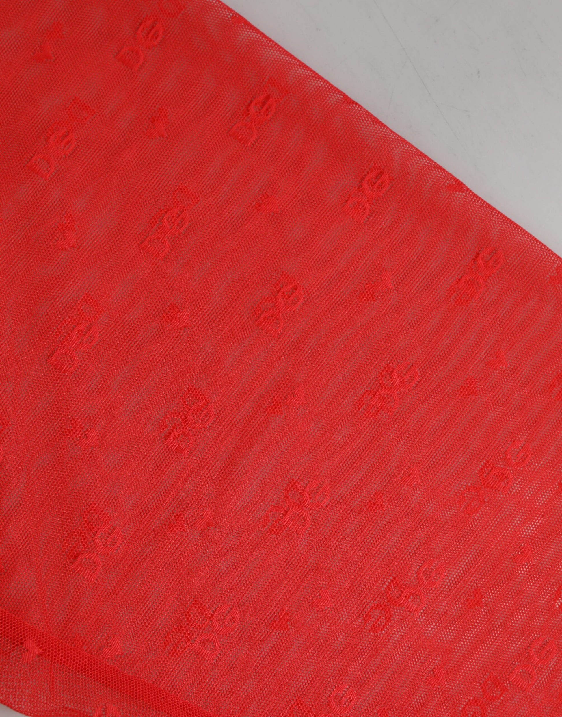 Red fabric with embroidery pattern