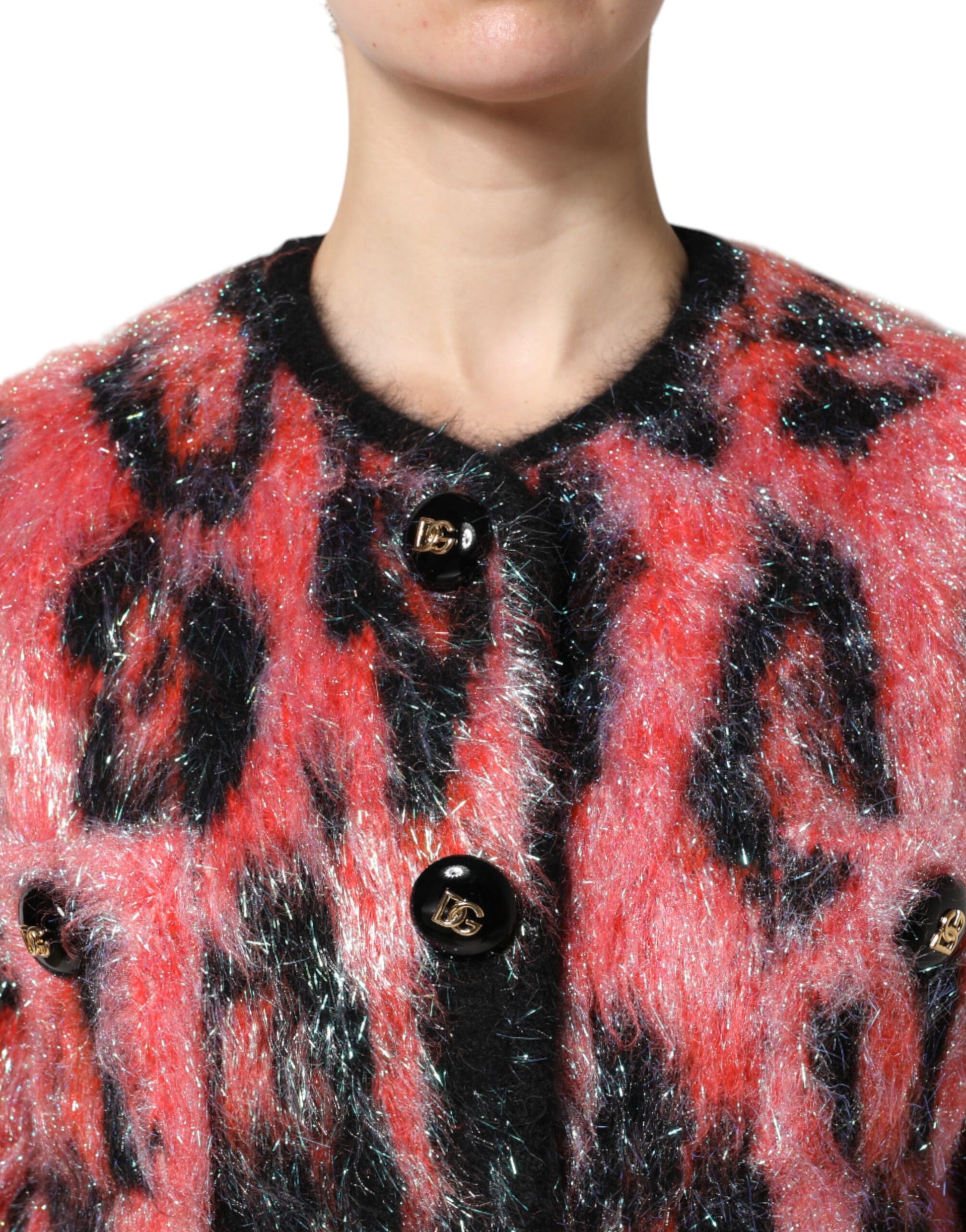 Woman wearing a red and black fur coat with buttons