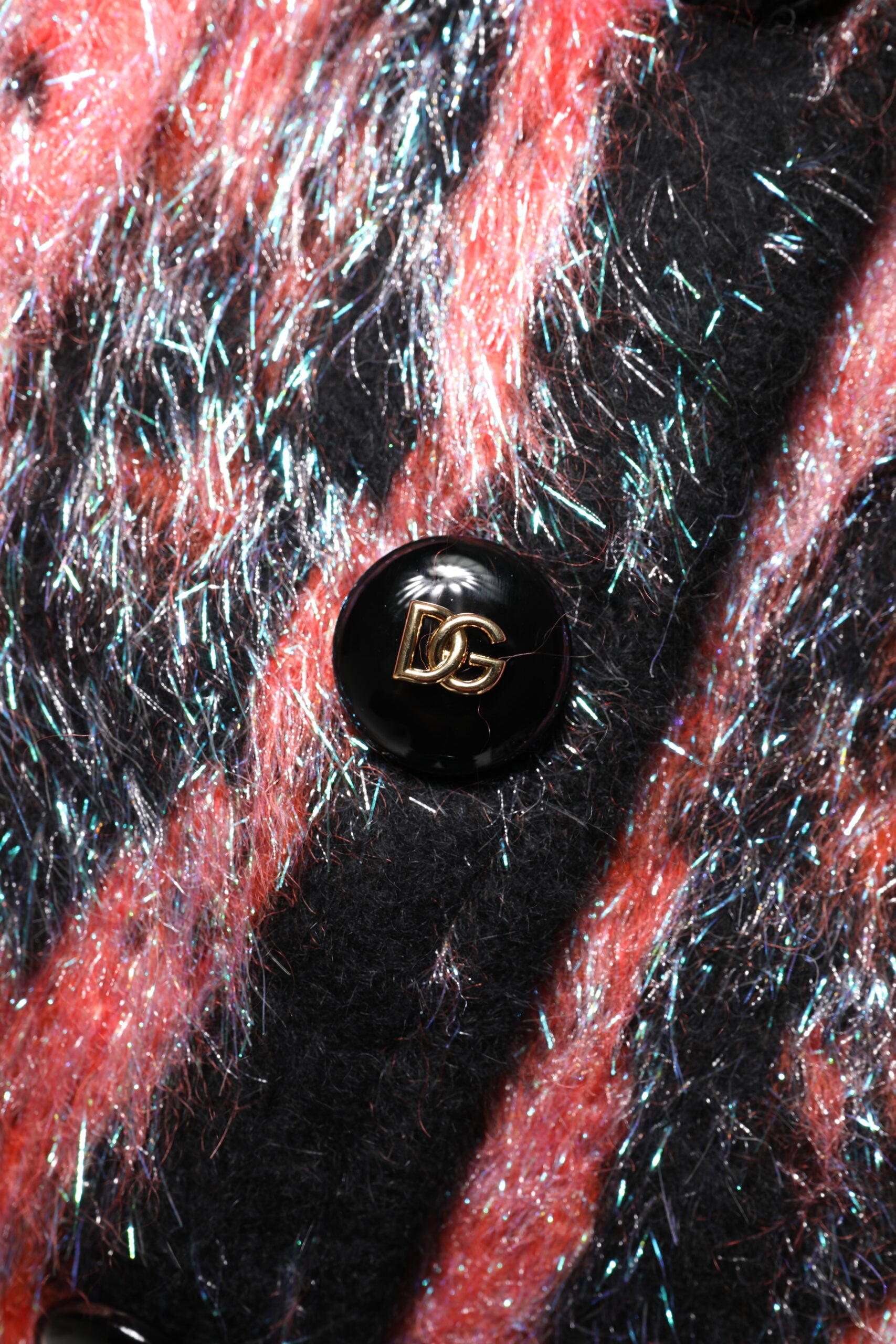 Black button on red fabric