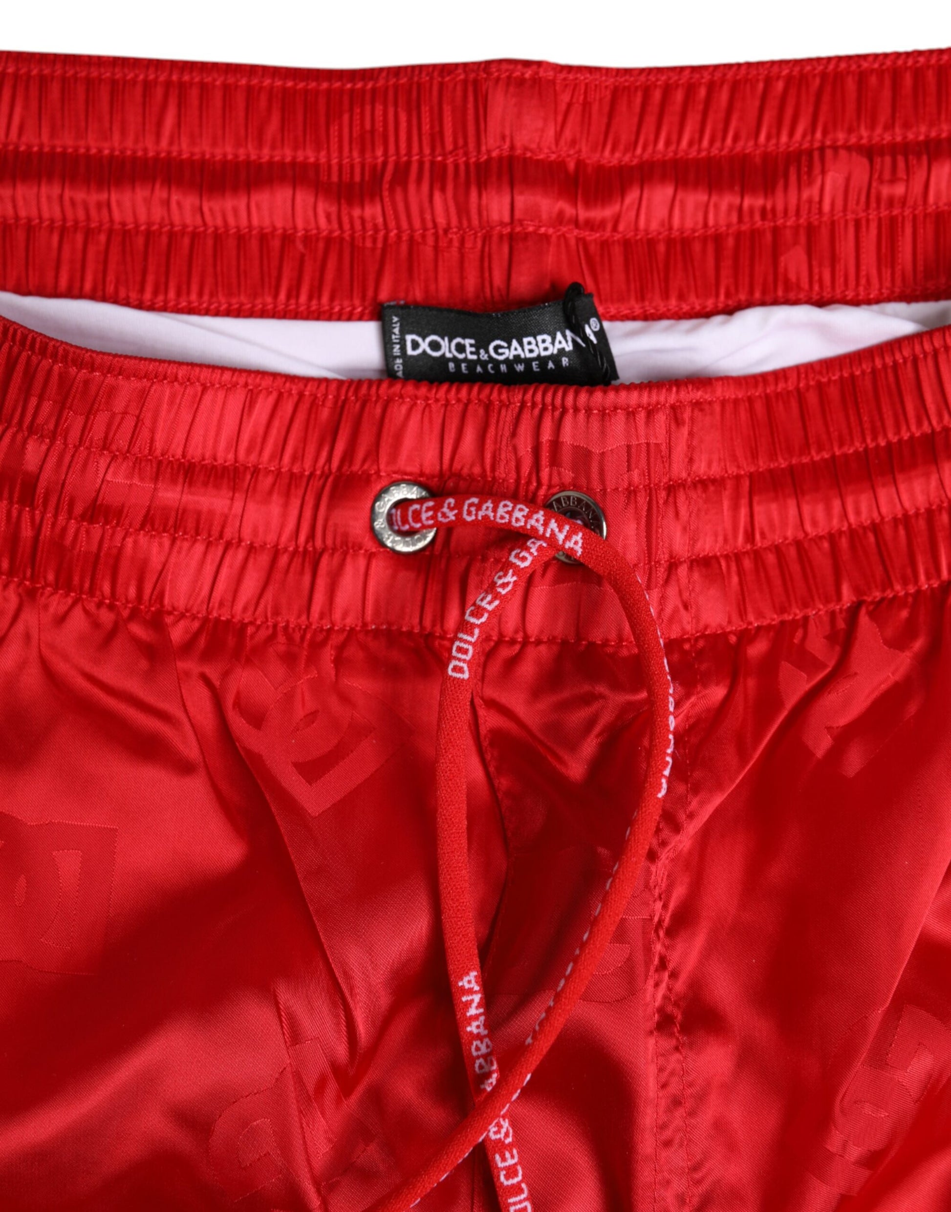 Red swim trunks with white trim