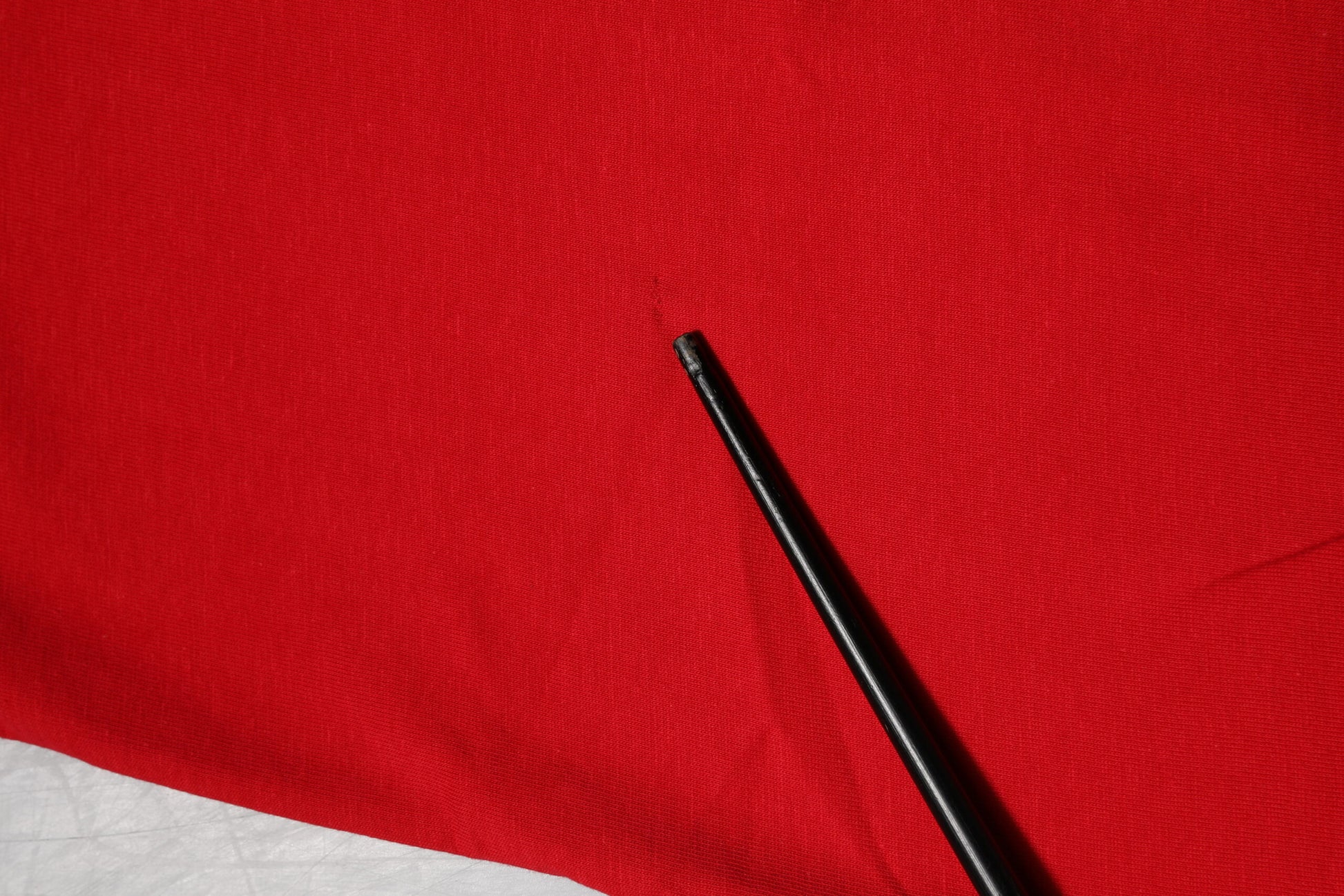 Black pen on red fabric