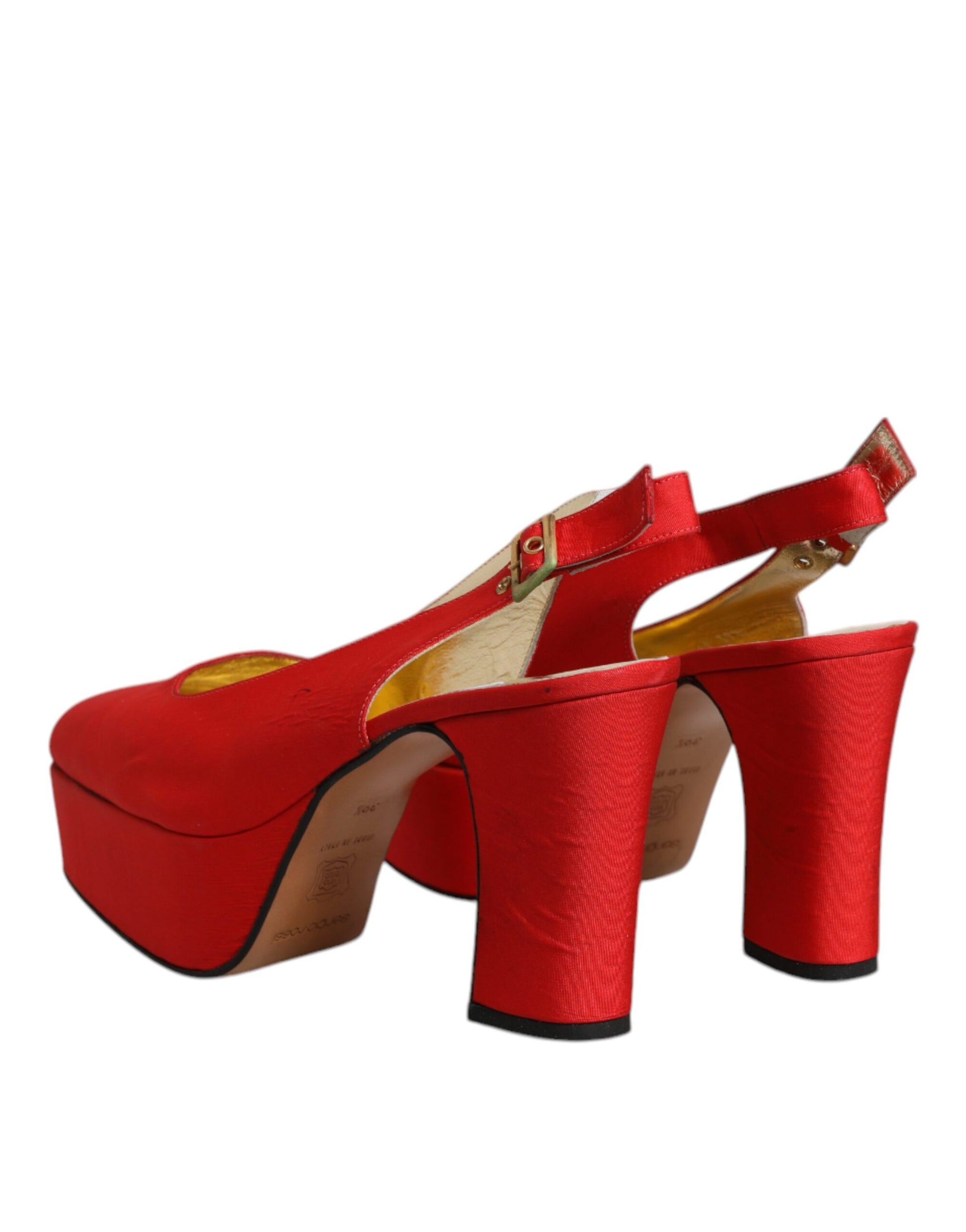 Red high heel shoes with gold accents