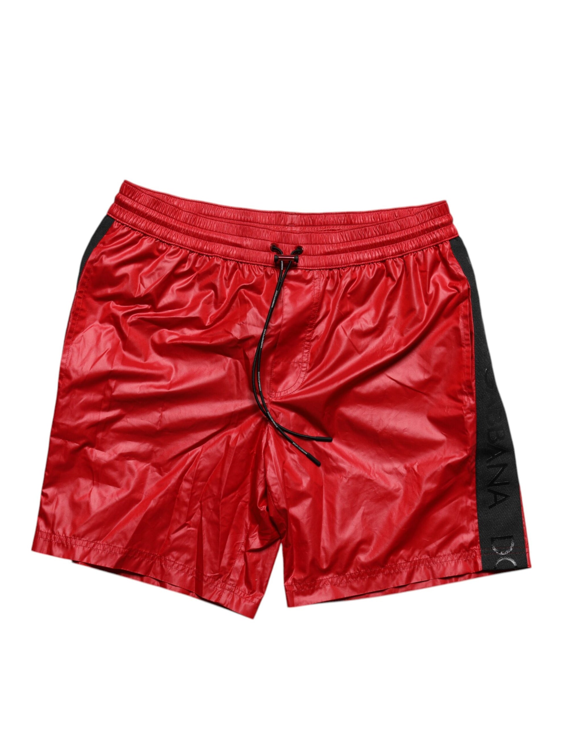 Red polyester beachwear shorts with black trim and drawstring