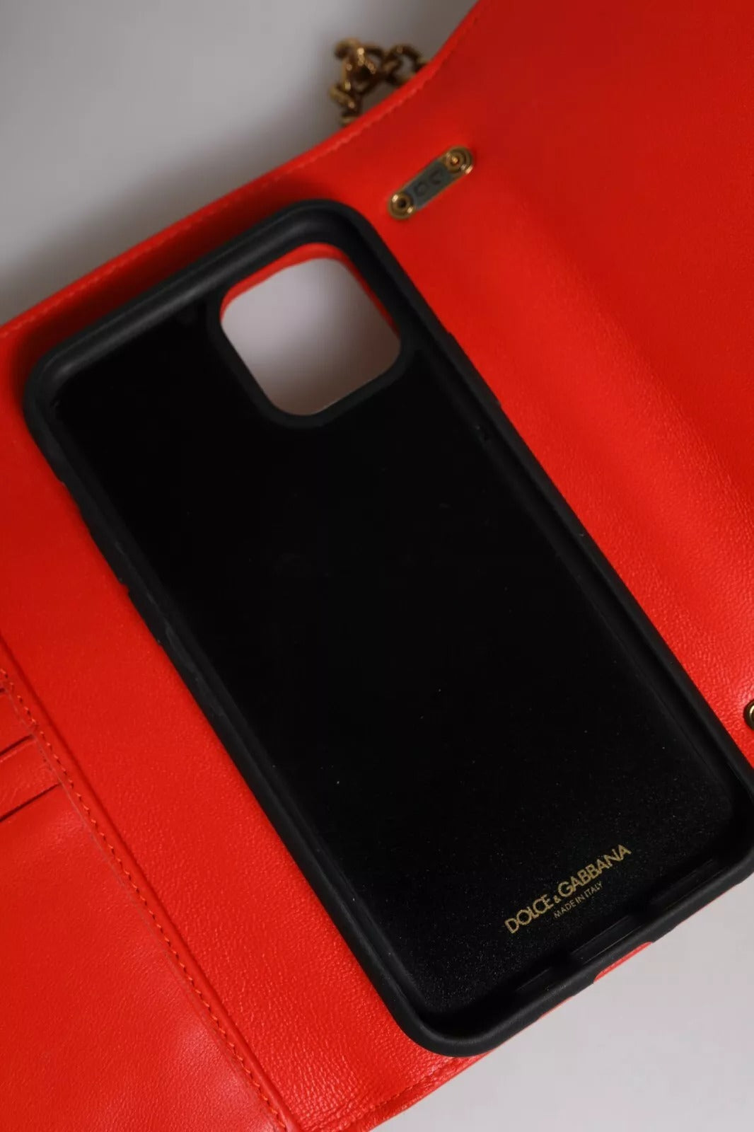 Black phone case on red wallet