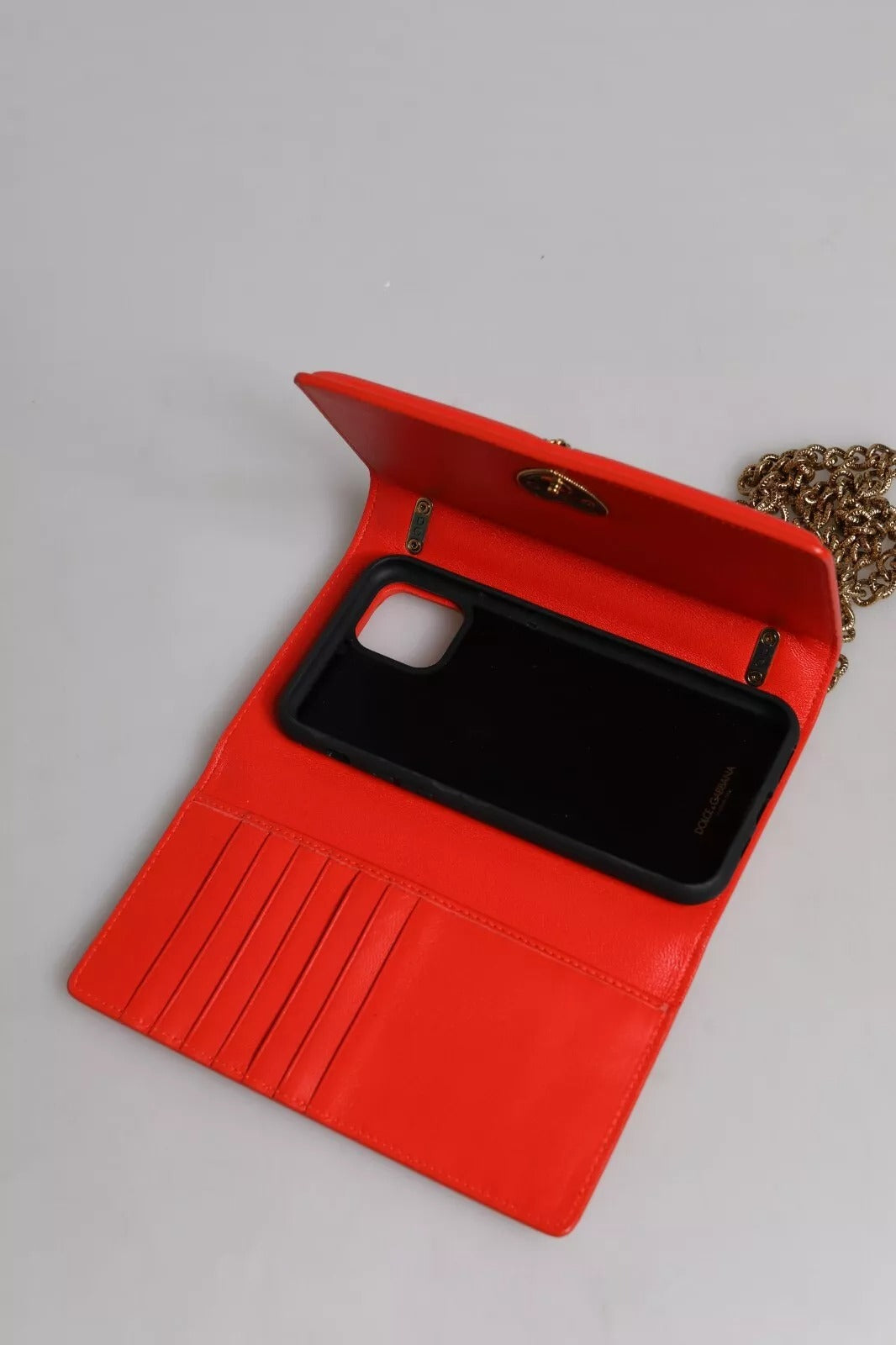 Red phone case with black border and cutout for camera