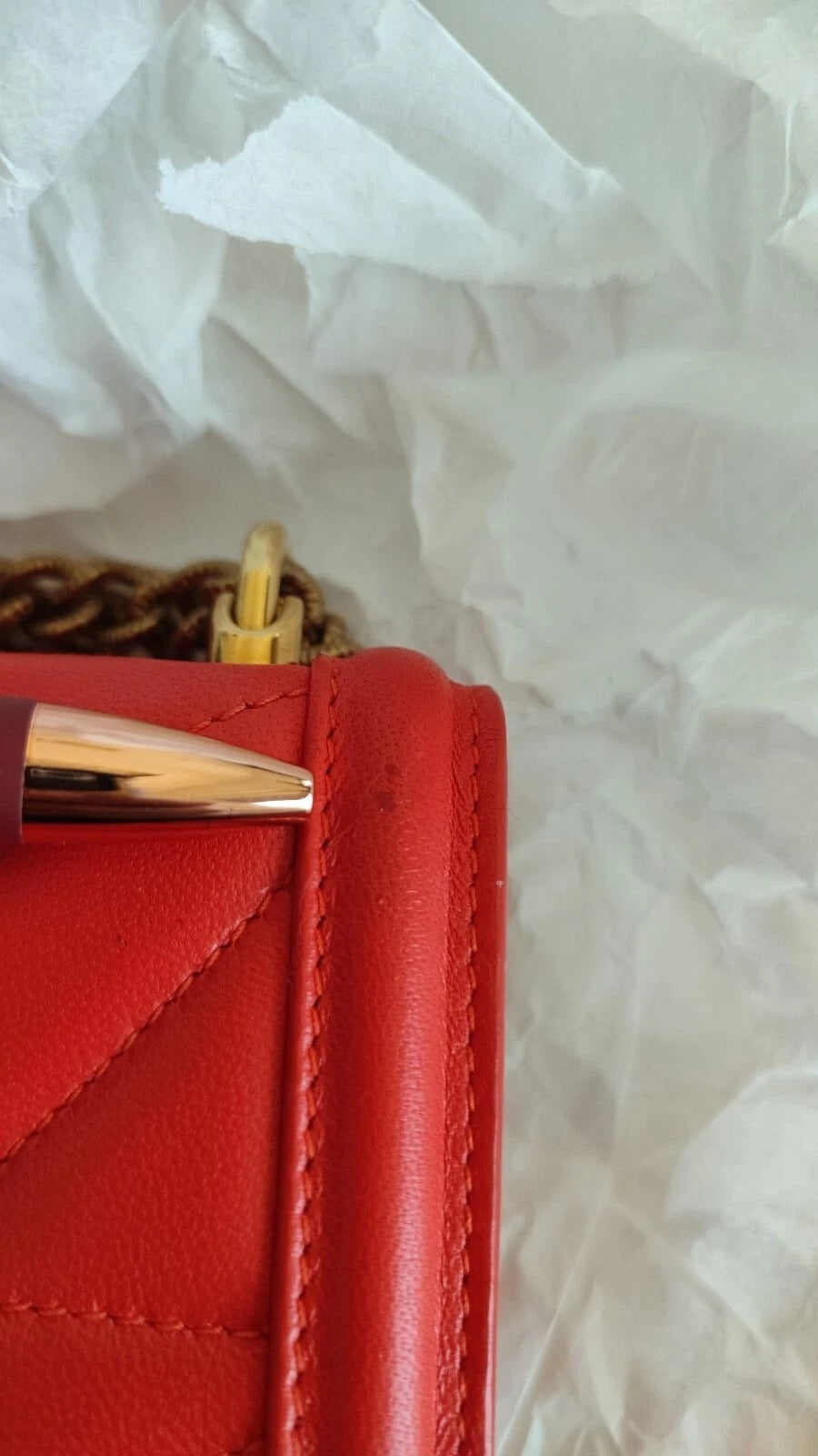 Red leather wallet with gold zipper pull