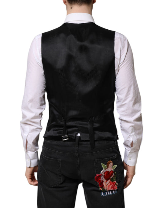 A black vest with red sequins on a mannequin