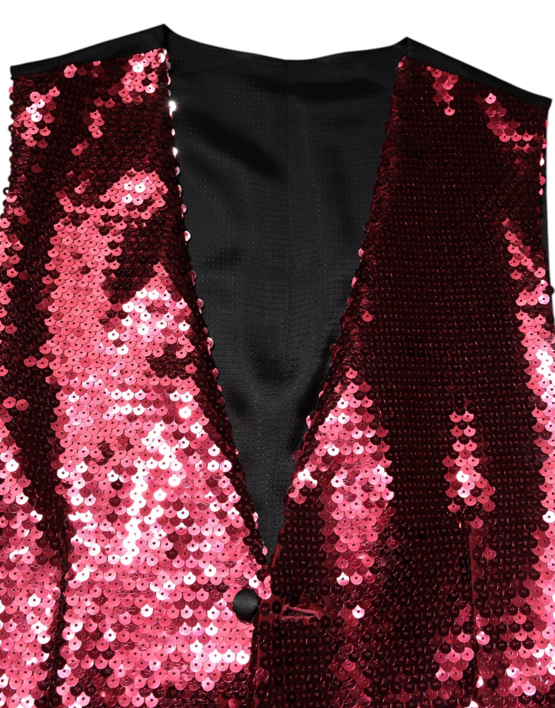 A black vest with red sequins, part of a formal men's suit