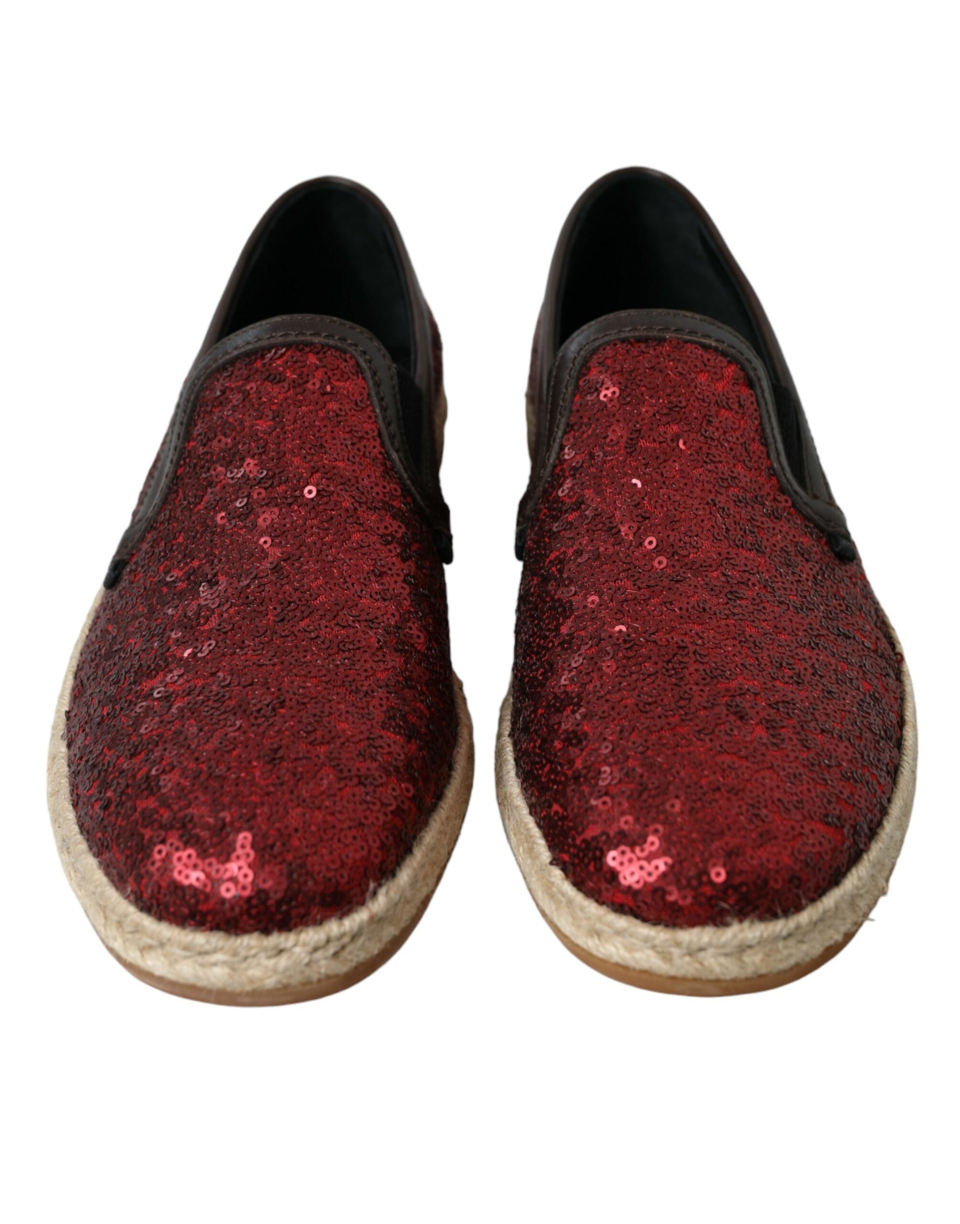 Pair of red glittery shoes with tan soles