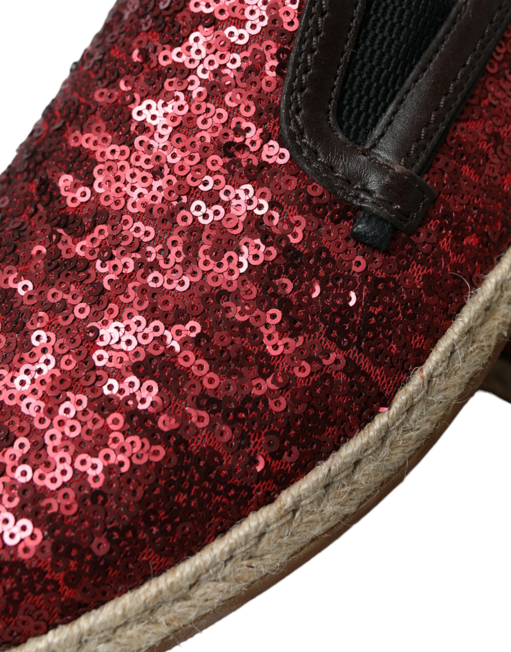 Red glittery shoes with a brown strap and sole
