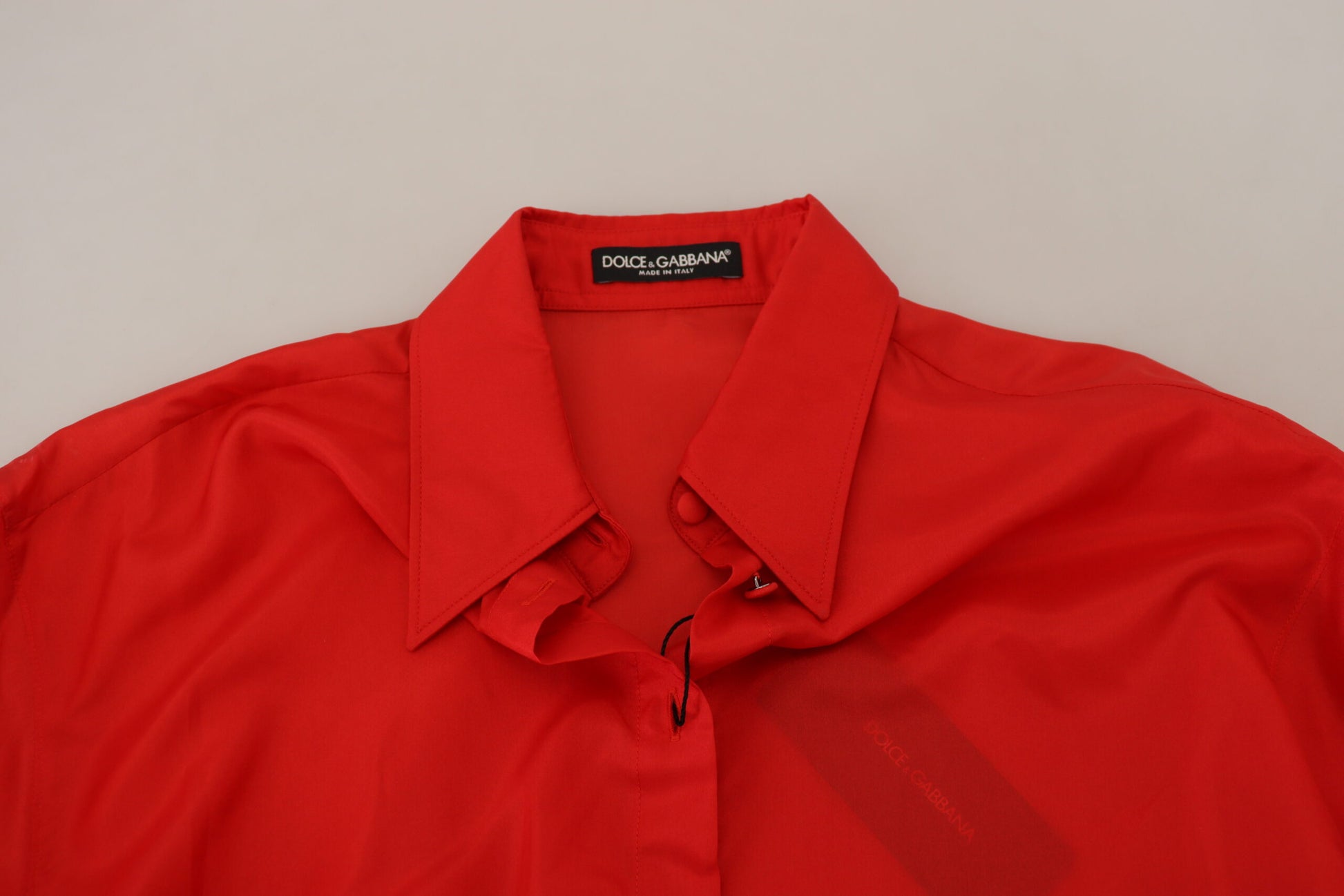 A red silk collared long sleeve dress shirt top