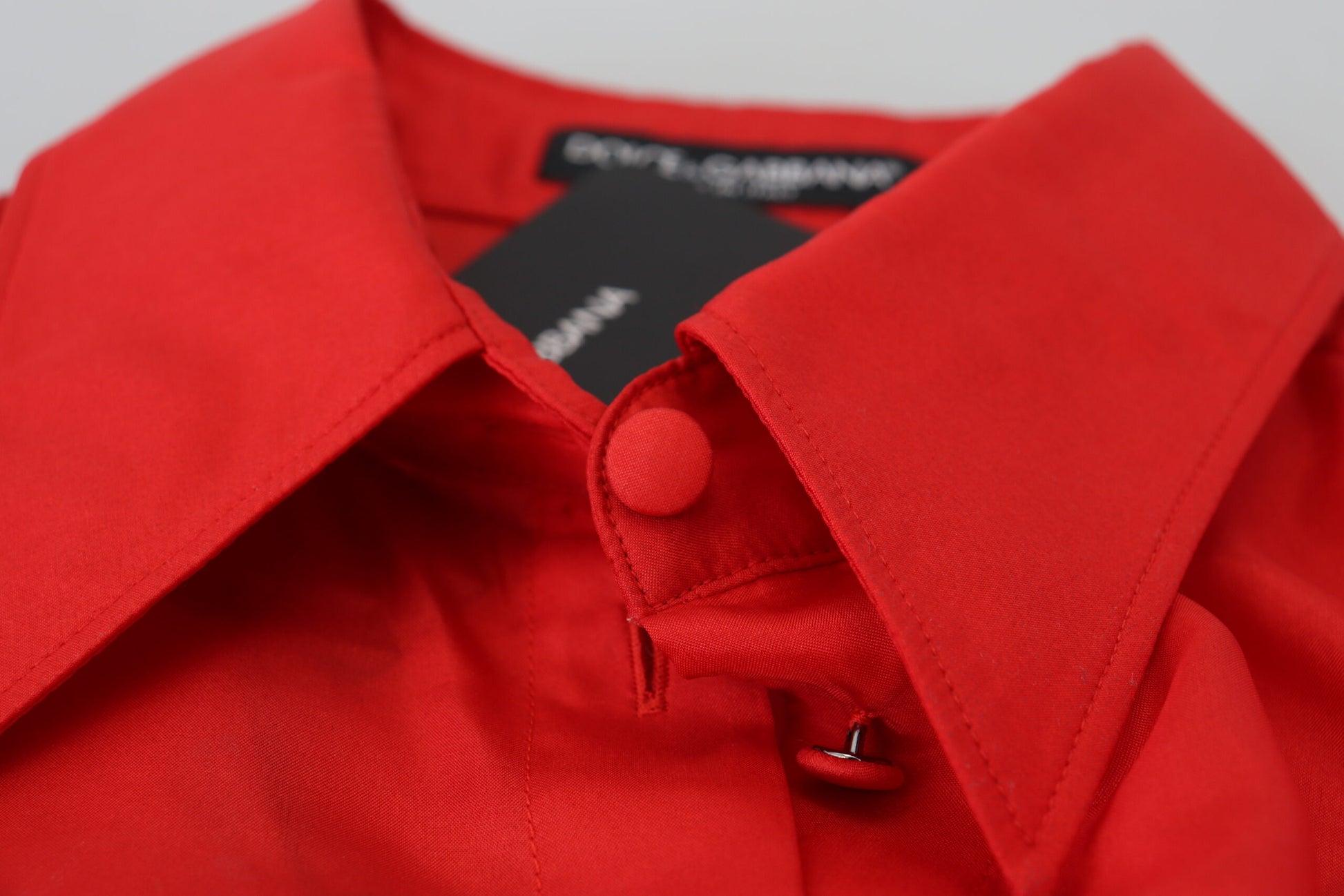 A red silk collared long sleeve dress shirt top