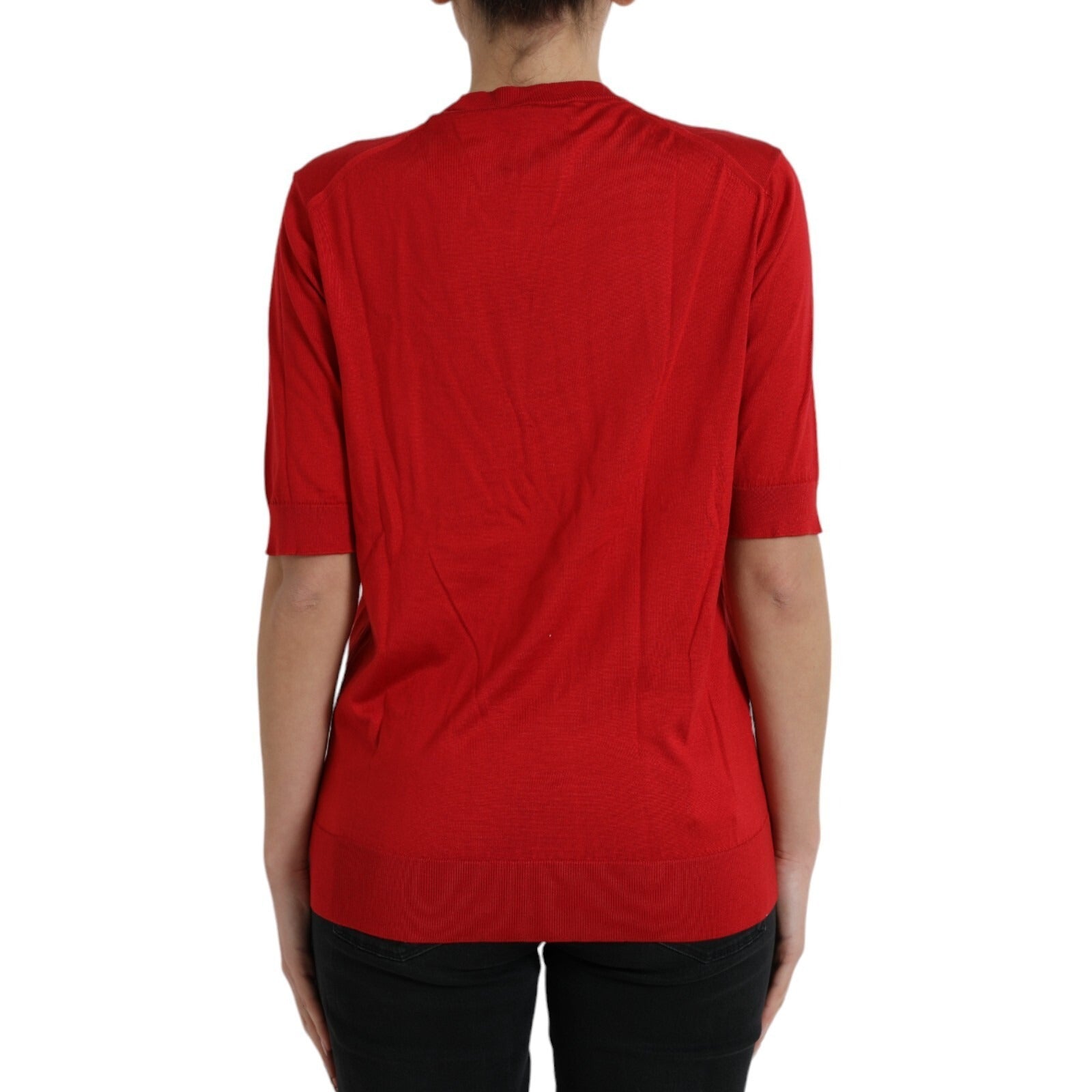 Red long sleeve sweater on a person's back