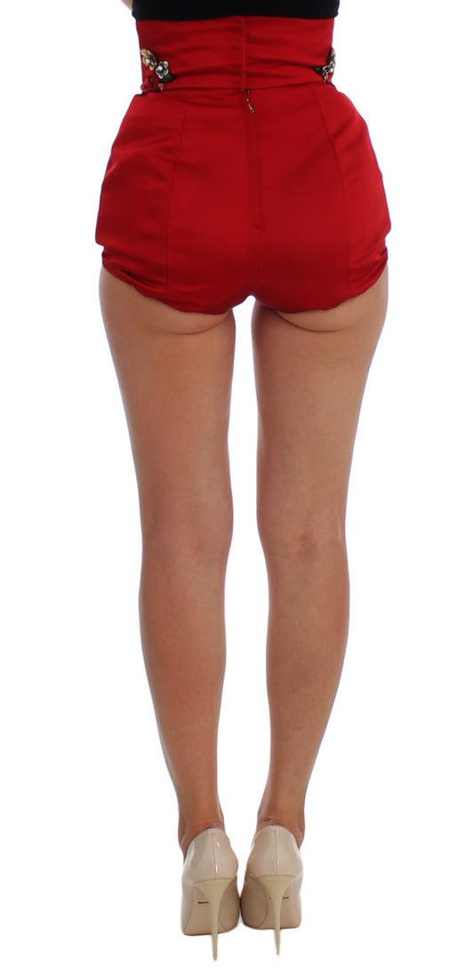 Woman wearing red shorts and high heels