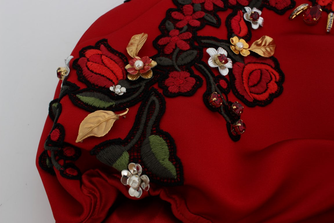 Red embroidered garment with floral pattern and gold accents