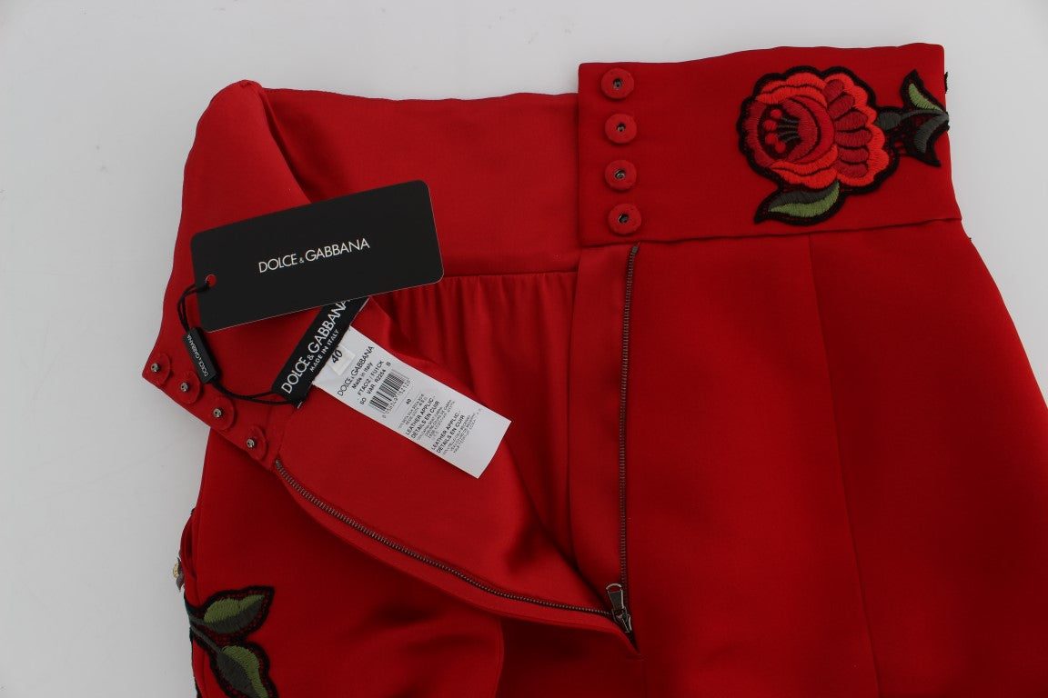 Red pants with floral embroidery on waistband