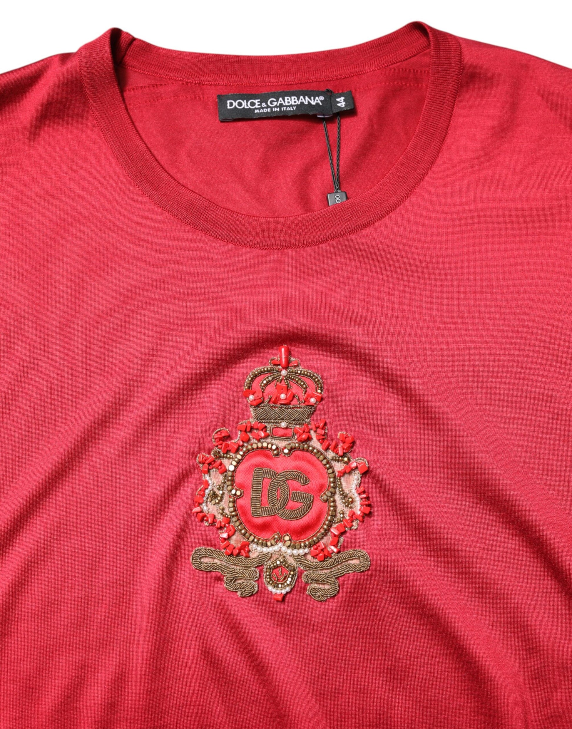 Red shirt with embroidered emblem on front