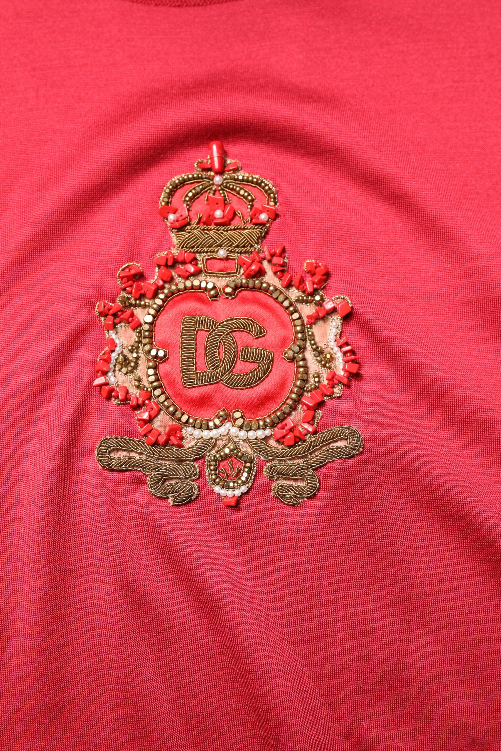 Red embroidered emblem on fabric