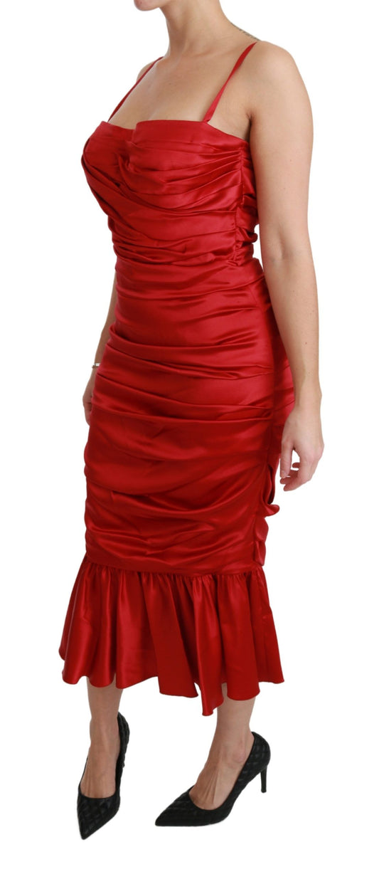 A red mermaid dress with ruffles at the hem and sleeves, designed by Dolce & Gabbana
