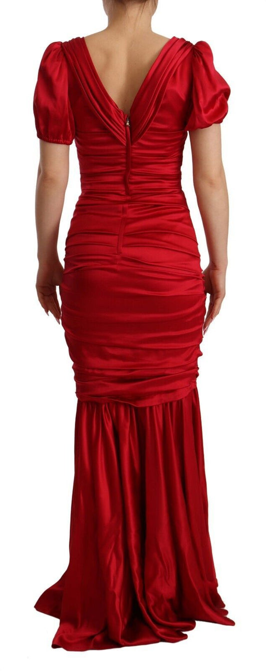 A red mermaid gown with ruffled sleeves and hem