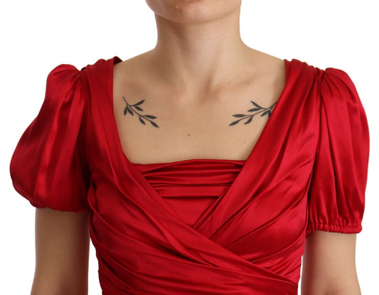 A red silk stretch sheath mermaid gown dress with a deep V-neckline and short sleeves
