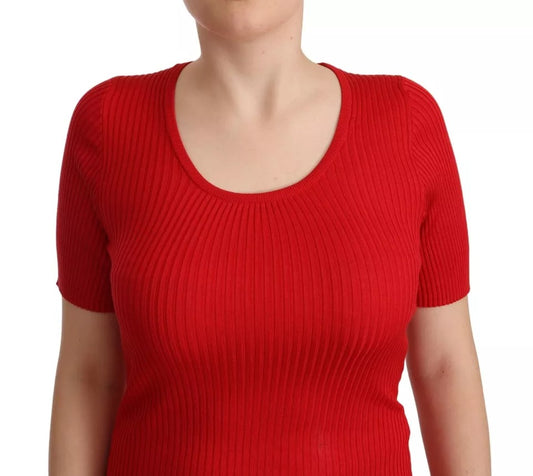 Red knit sweater on woman's torso