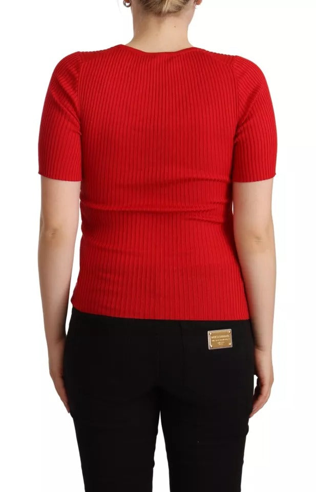 Red knit sweater on woman's back