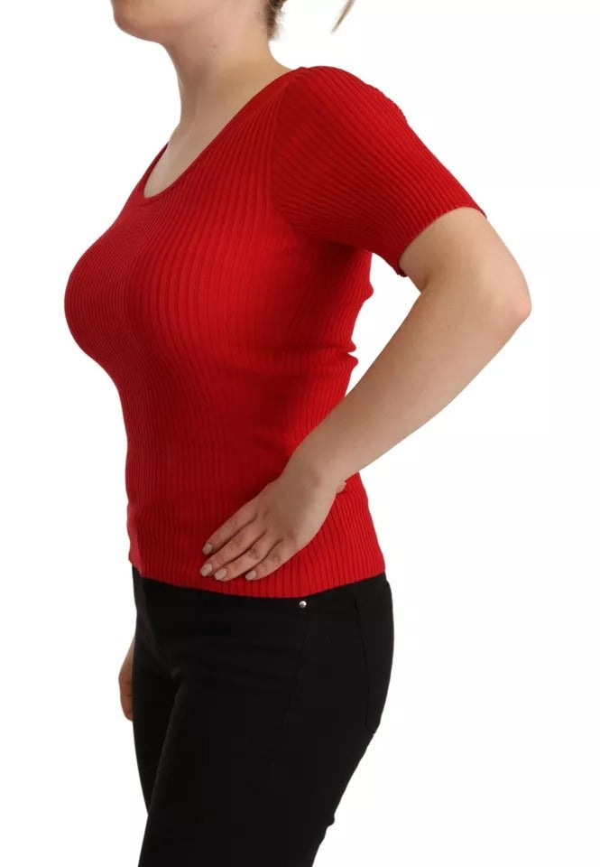 Woman wearing red top and black pants