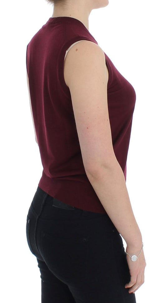Woman wearing burgundy top and black pants