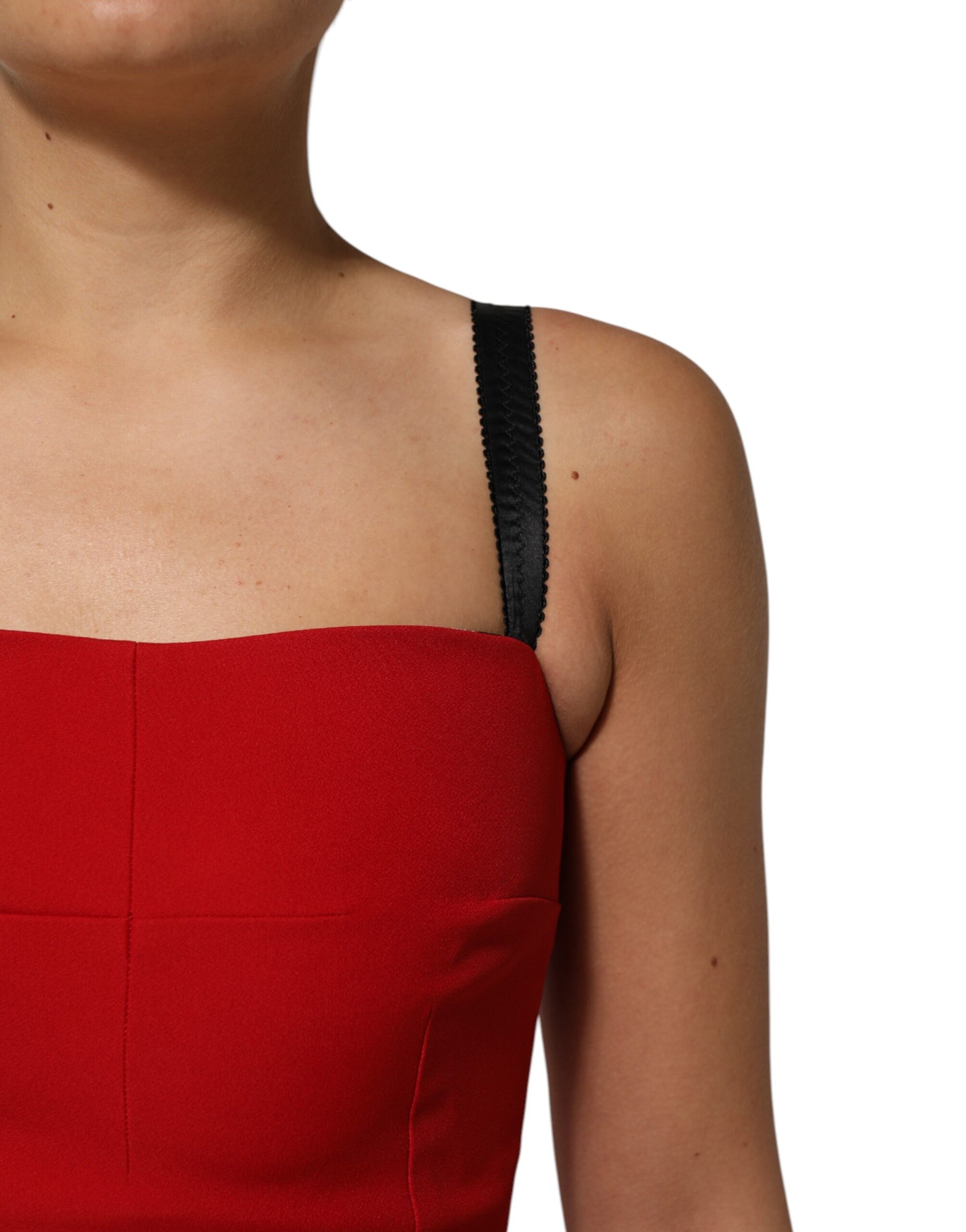 A red stretch bodycon sheath knee length dress with black straps