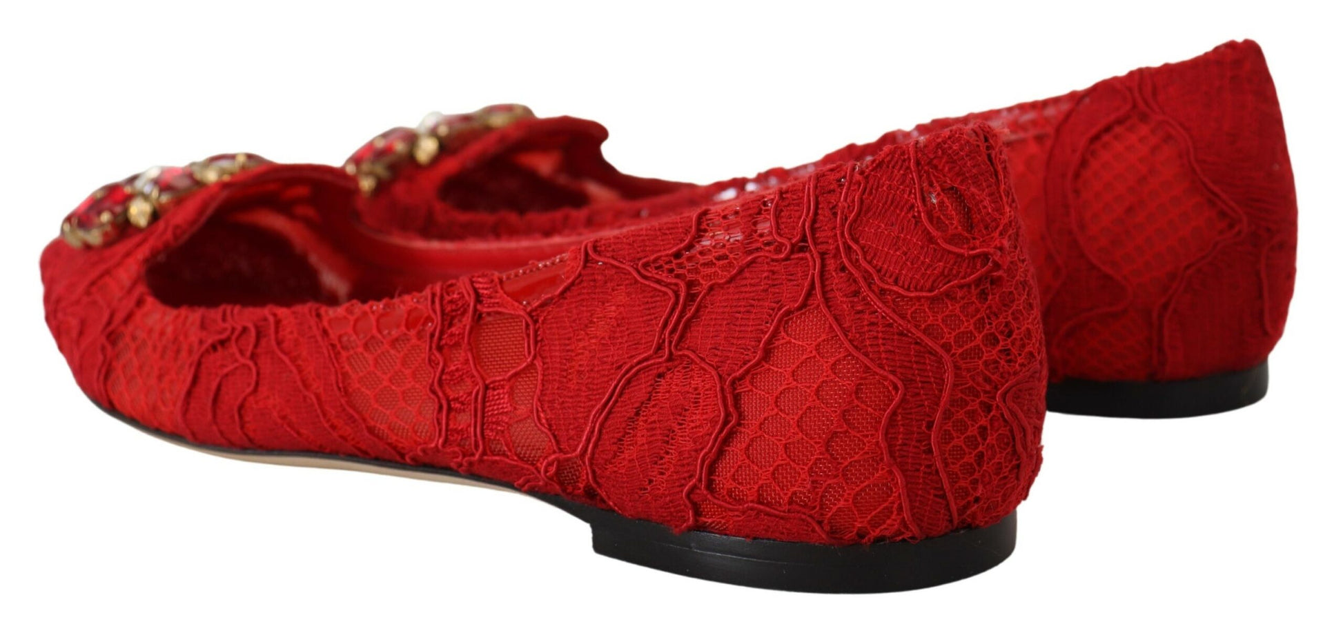 Pair of red high heel shoes with embroidered design and gold accents