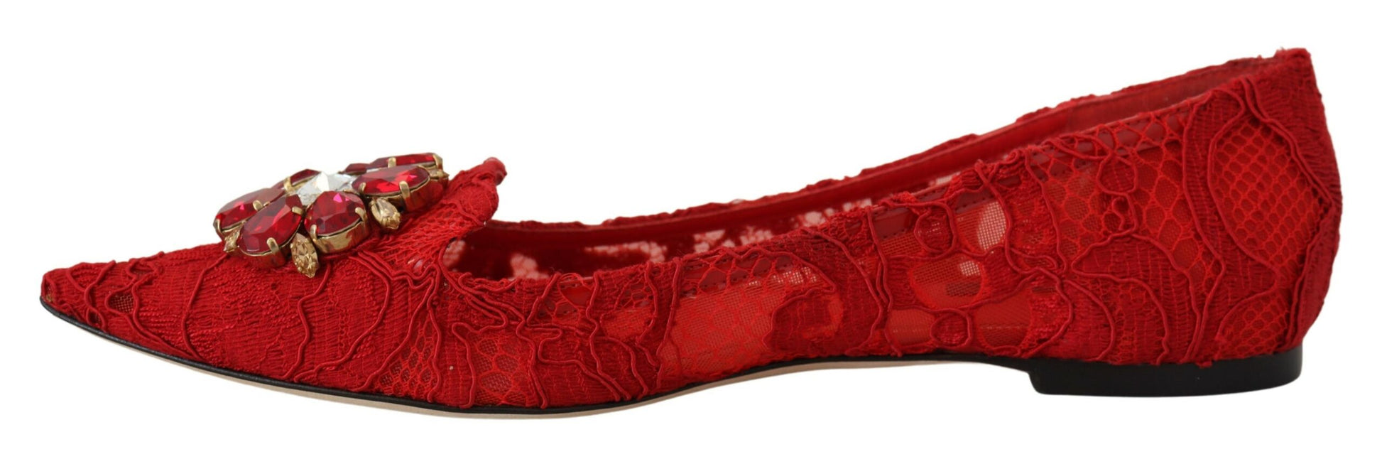 Red high heel shoes with embellishments and a bow on top