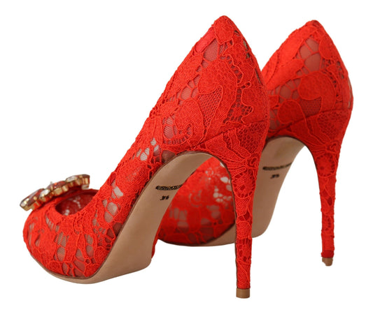 Red high heel shoes with lace detailing and a bow on top