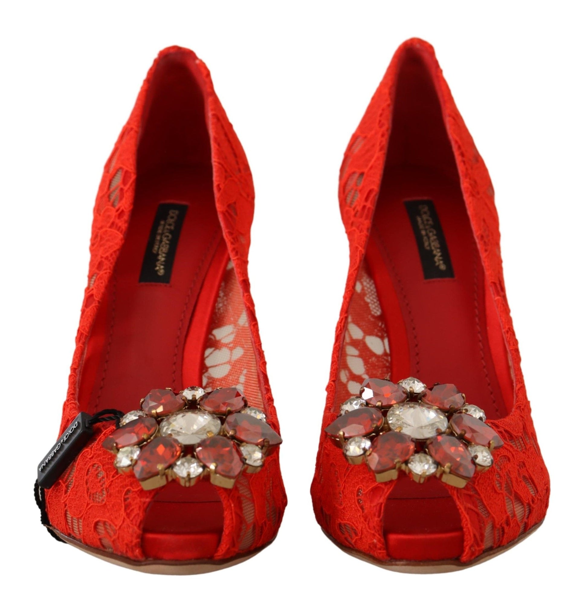 Red lace shoes with embellished heels and a bow on the side