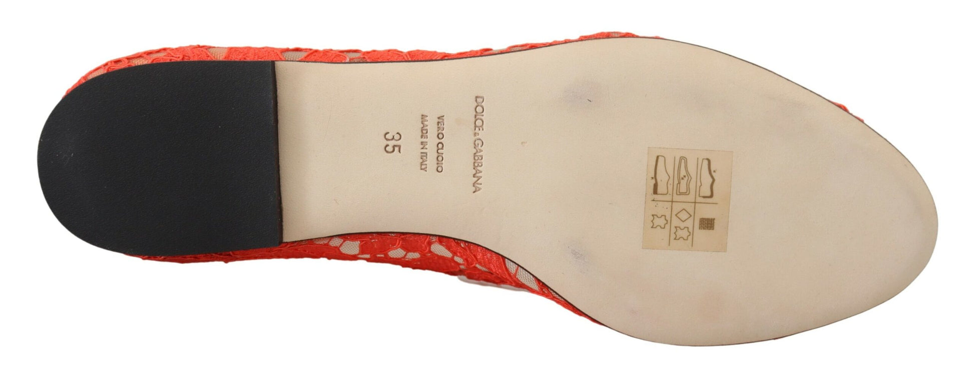 Foot in a shoe with red laces and black sole