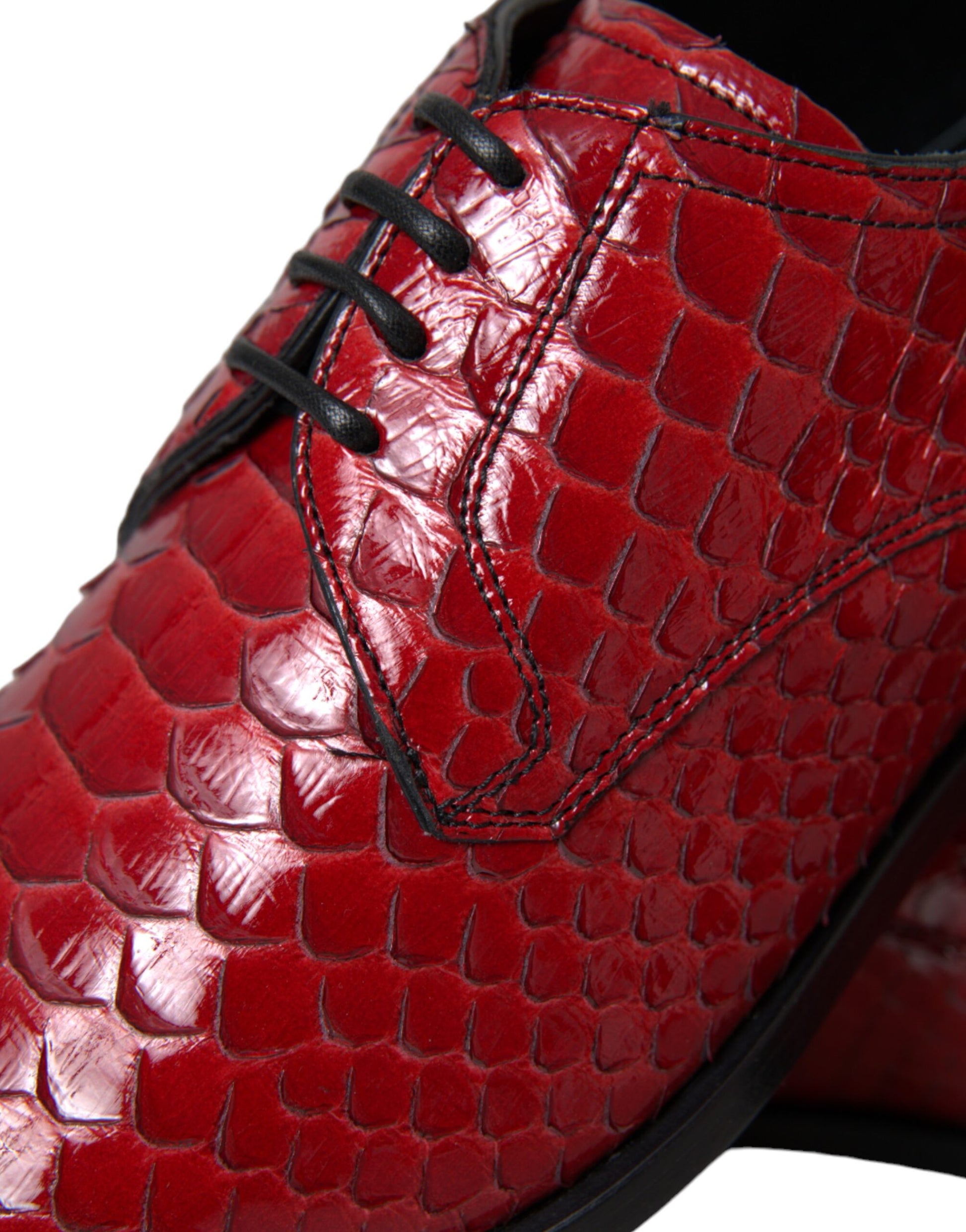 Red shoe with a crocodile skin texture