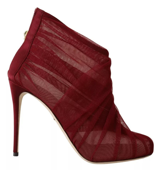 Red high heel boot with lace up detailing