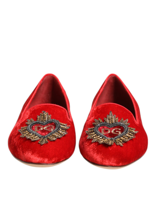 Pair of red velvet slippers with embroidered heart design