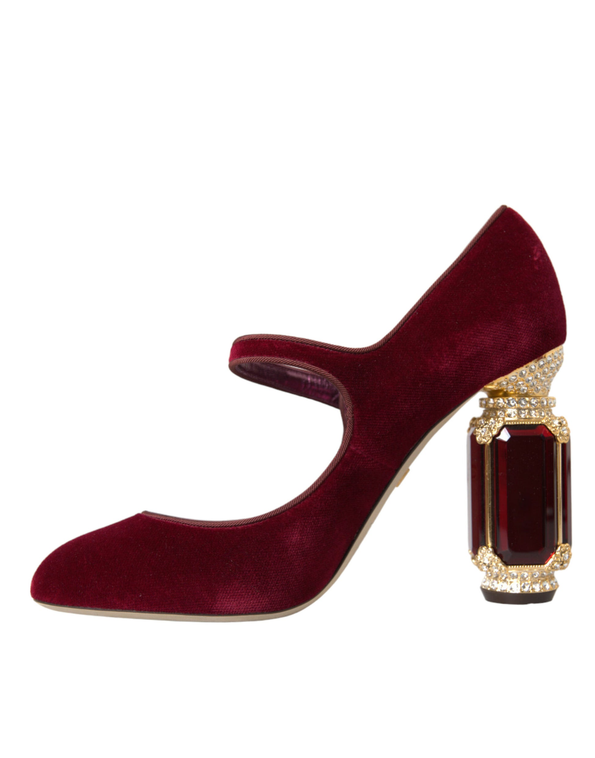 A single shoe against a plain background. It is a women's high heel shoe with a velvet texture and a pointed toe design